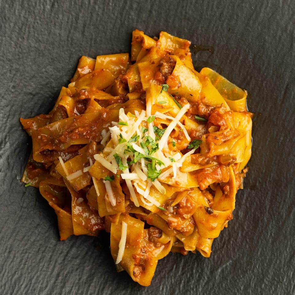 Pappardelle with meat sauce and parmesan