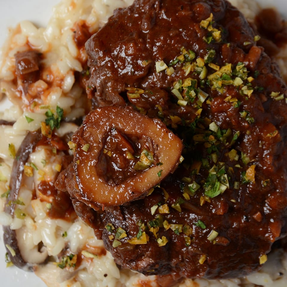 Braised meat over creamy mushroom risotto