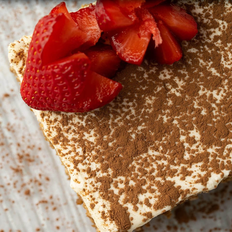 Tiramisu with cocoa and fresh strawberries